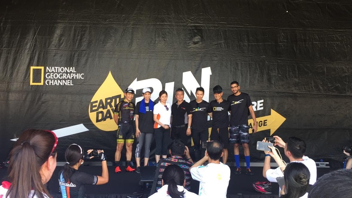 Taha Abbasi on stage at National Geographic Earth Day Run event in Singapore